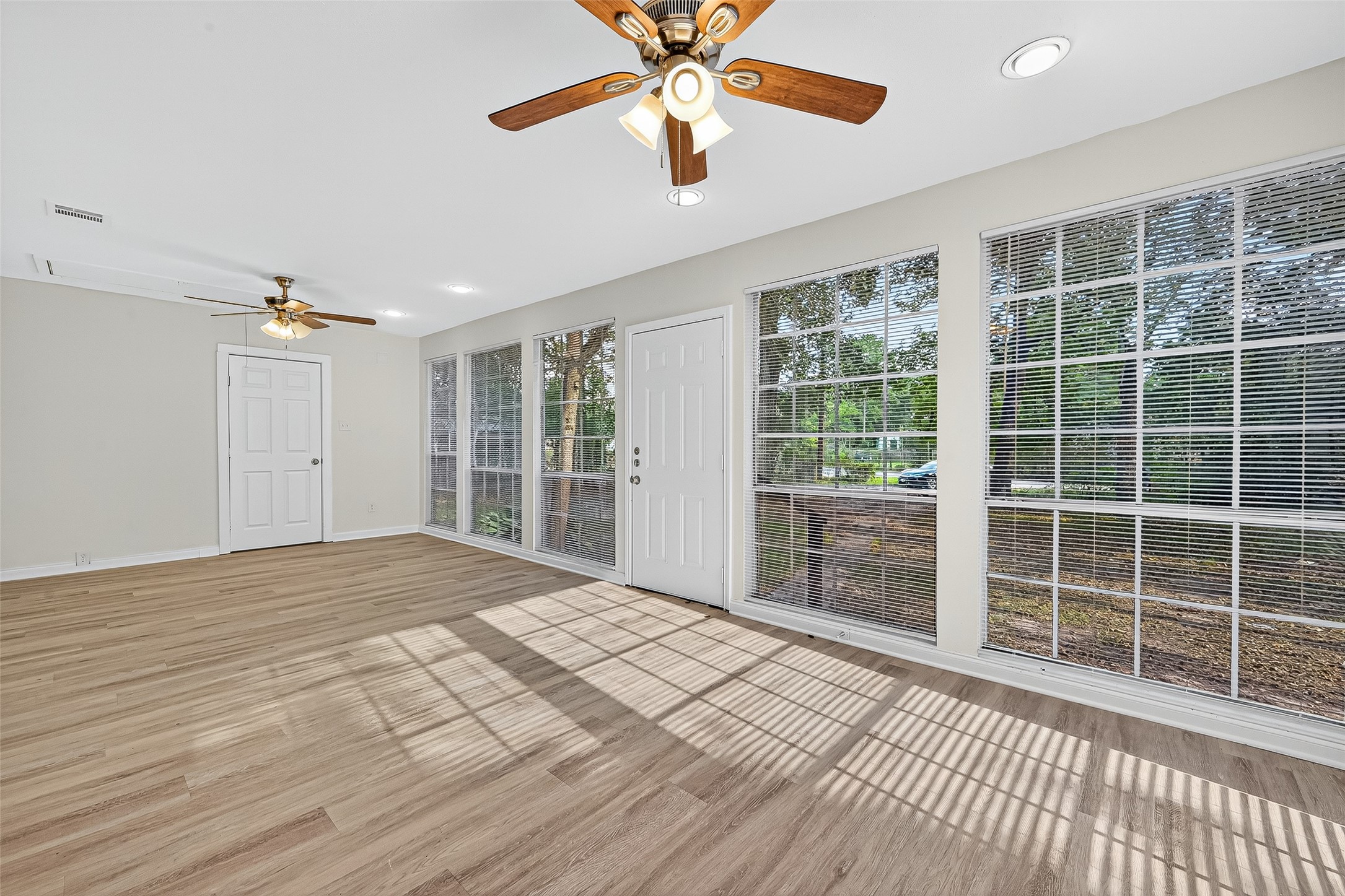 16643 Lake Circle Conroe, TX 77302 - Photo 11 of 47 a view of empty room with wooden floor and fan