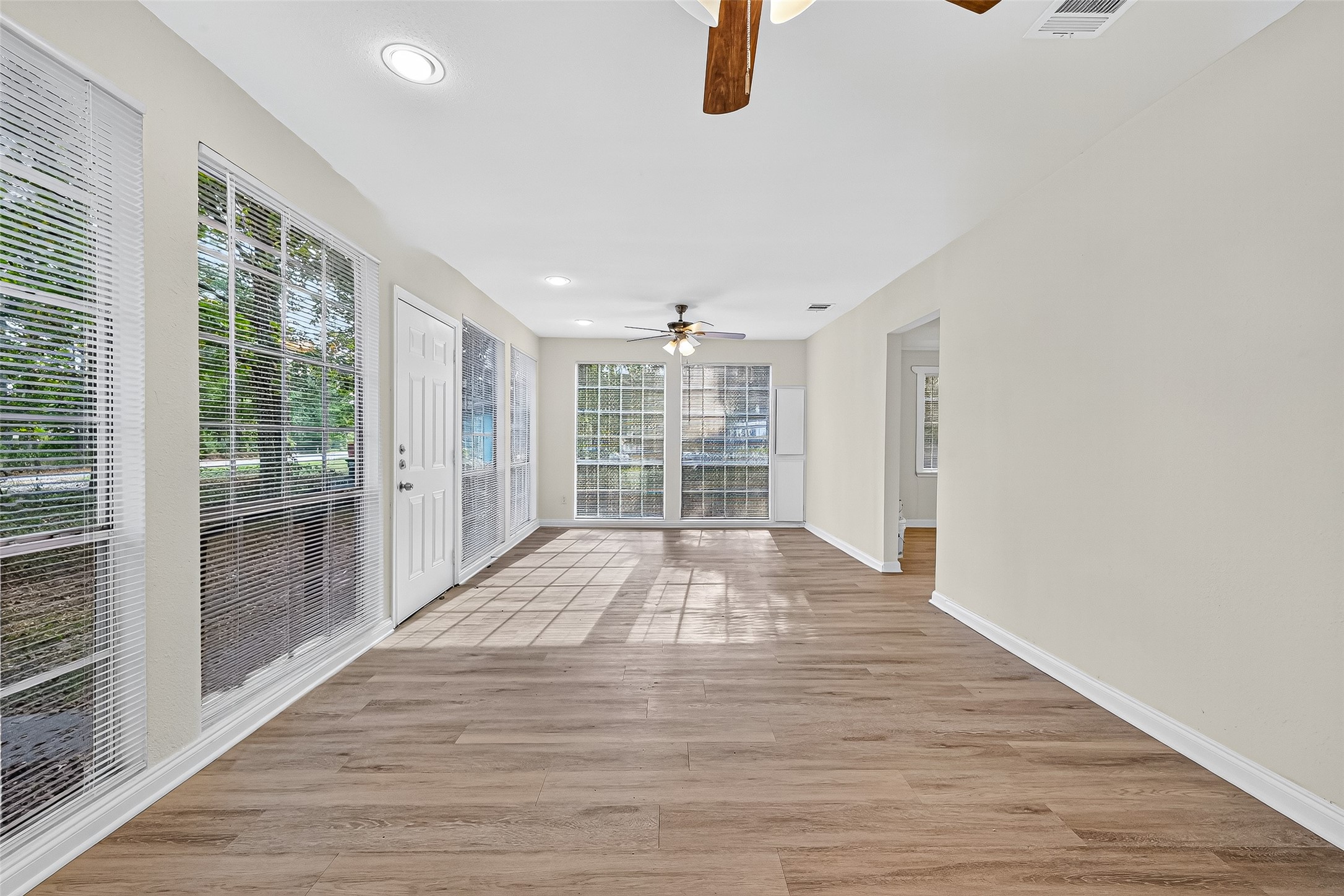 16643 Lake Circle Conroe, TX 77302 - Photo 14 of 47 a view of empty room with wooden floor and fan