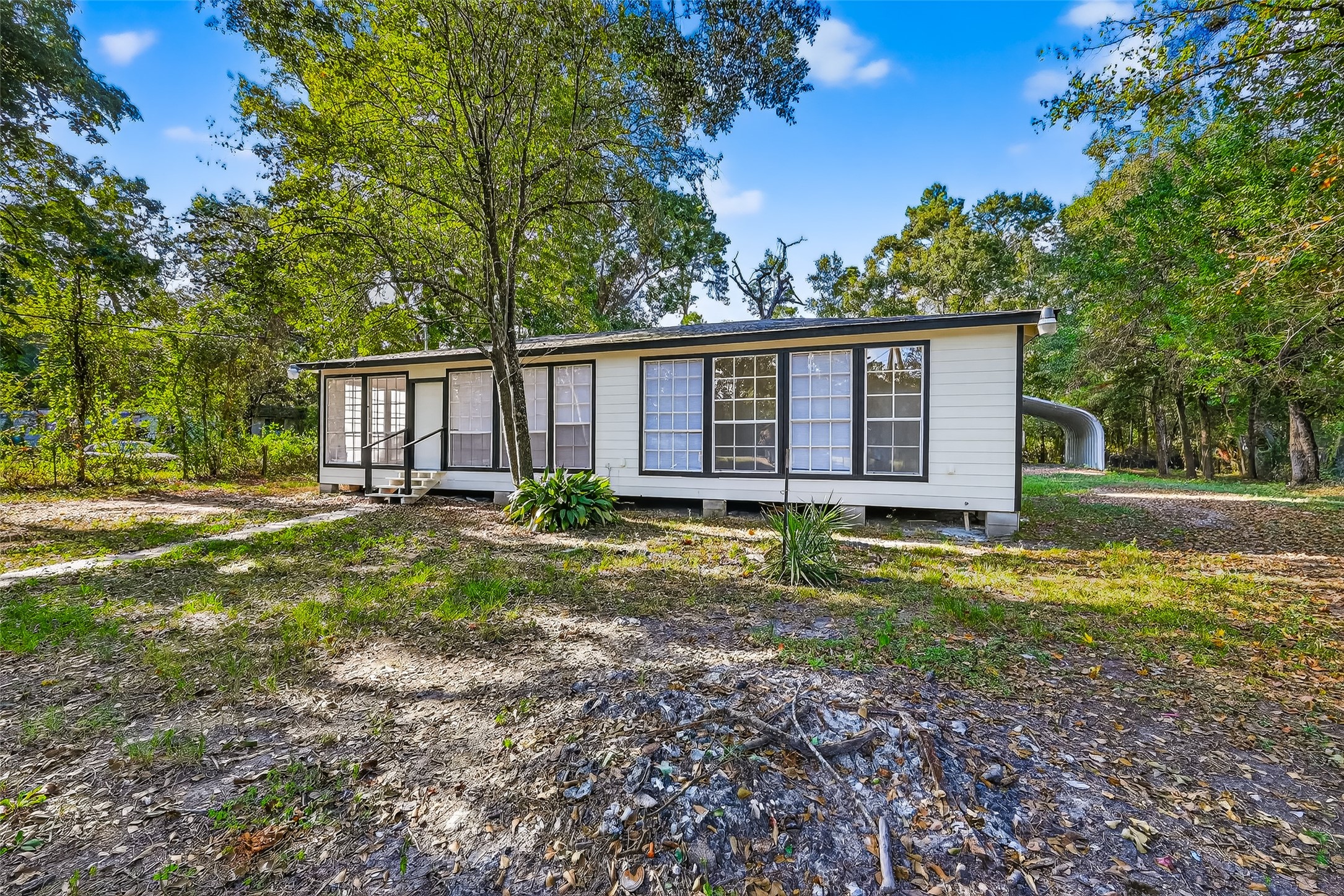 16643 Lake Circle Conroe, TX 77302 - Photo 4 of 47 a view of a house with backyard and sitting area