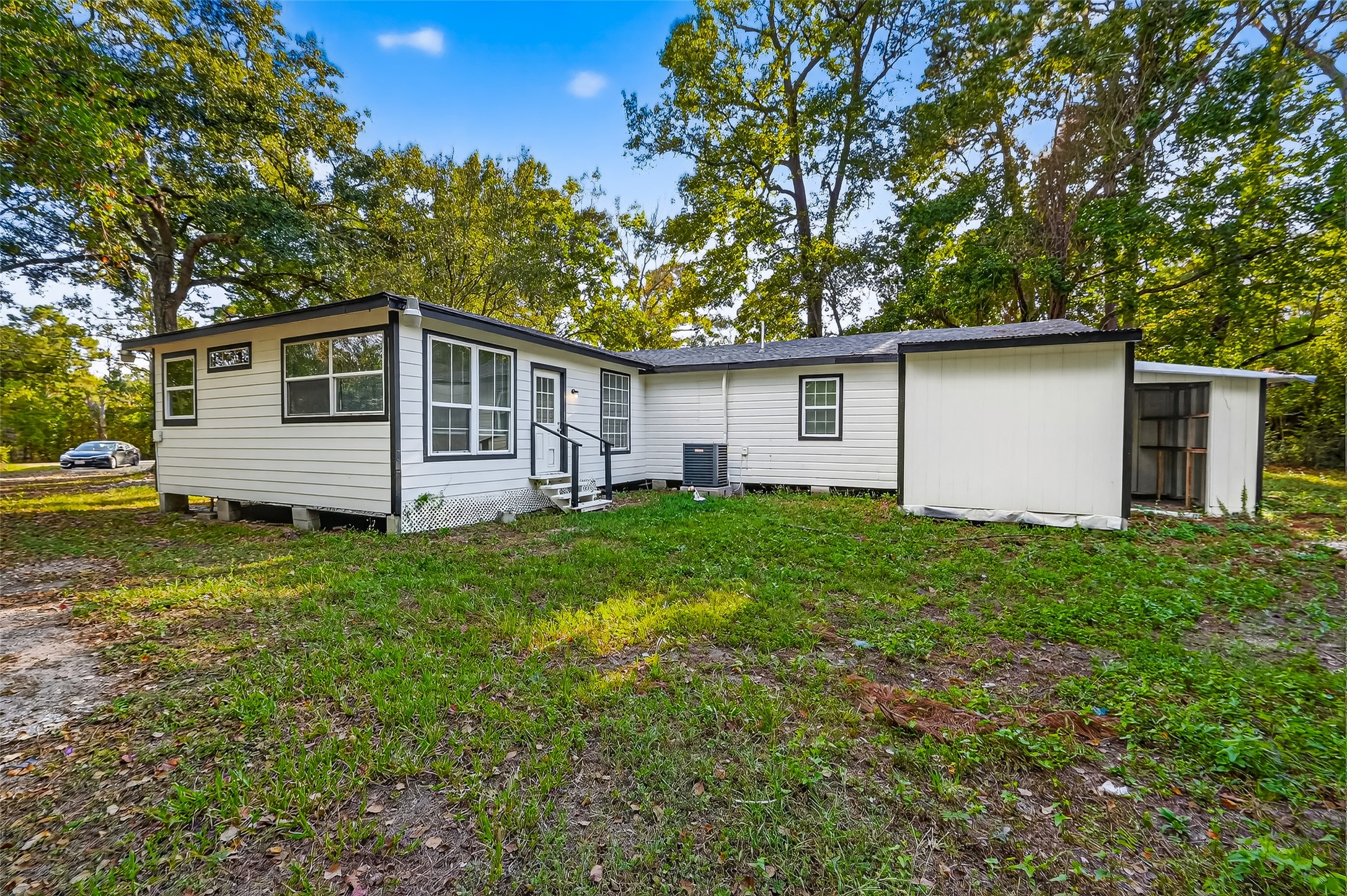 16643 Lake Circle Conroe, TX 77302 - Photo 46 of 47 a front view of house with yard and green space