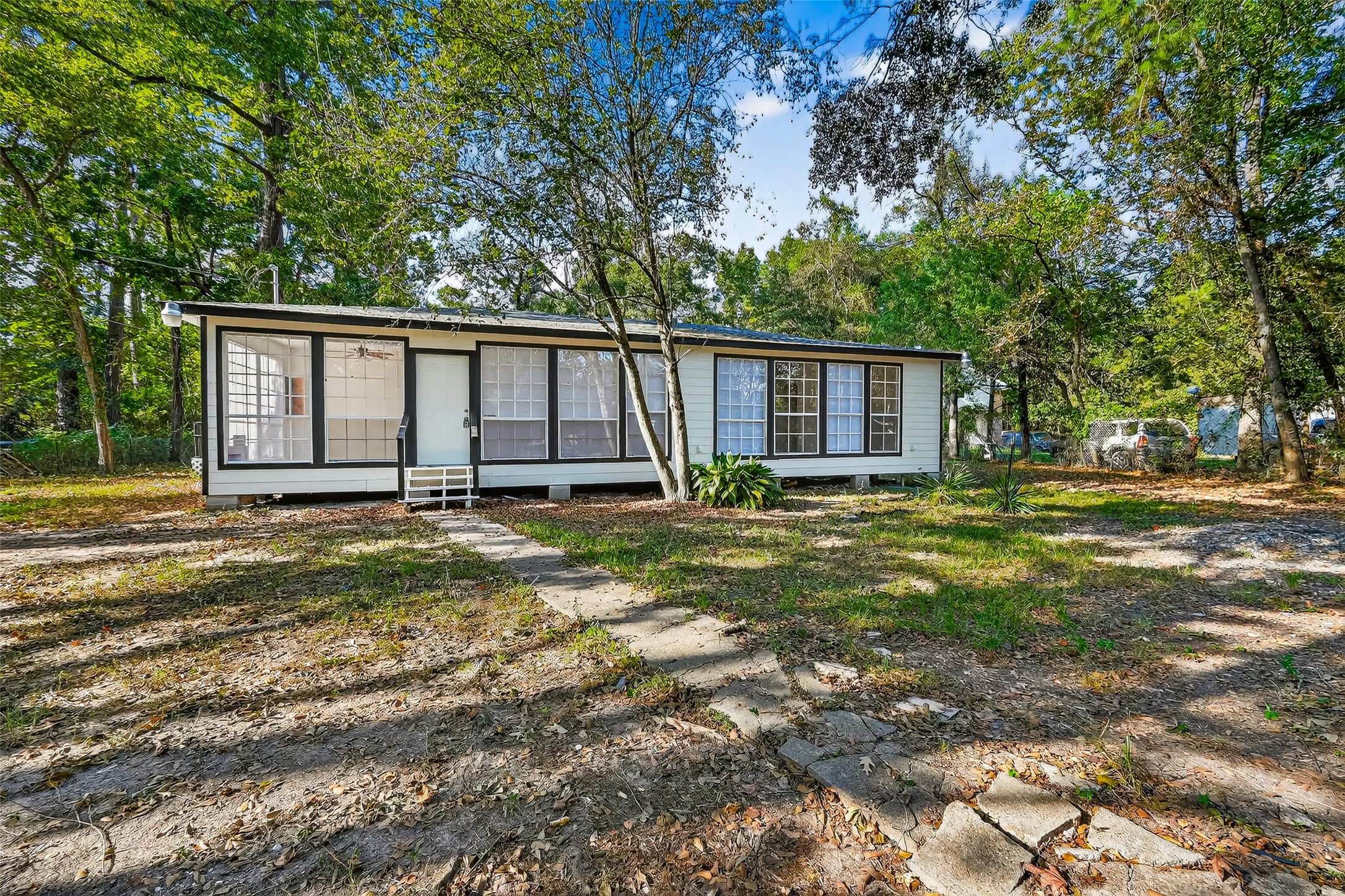 16643 Lake Circle Conroe, TX 77302 - Photo 6 of 47 a view of a backyard with large trees and plants