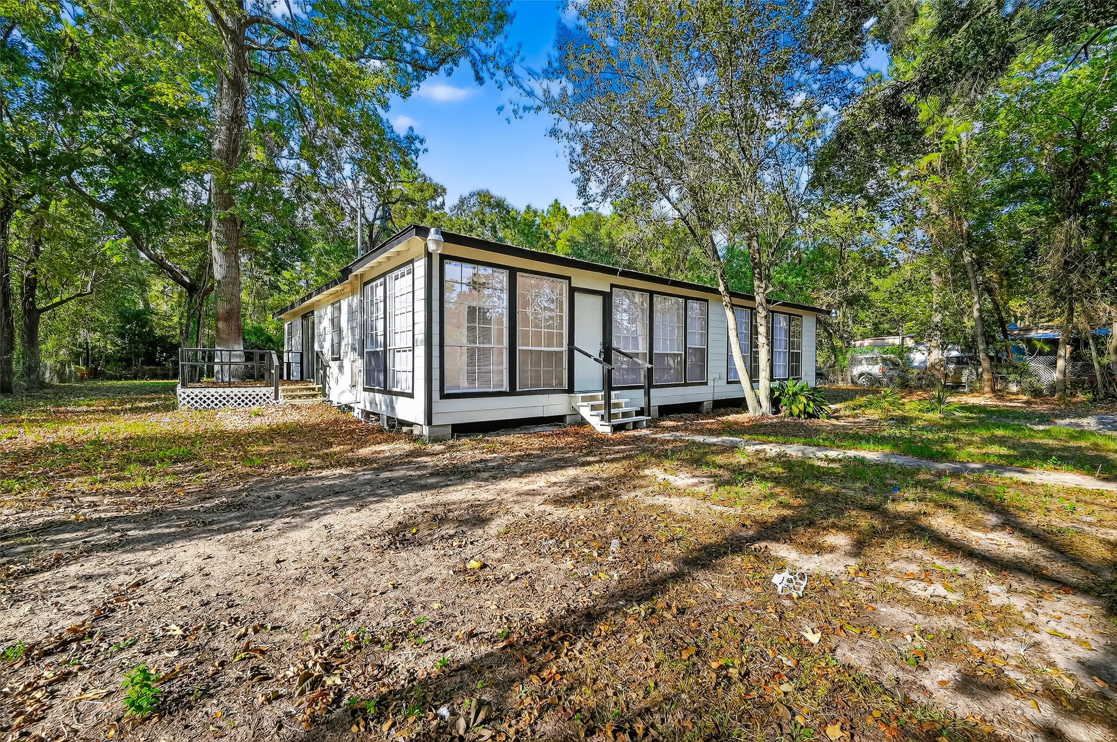 16643 Lake Circle Conroe, TX 77302 - Photo 7 of 47 a view of a house with backyard and trees