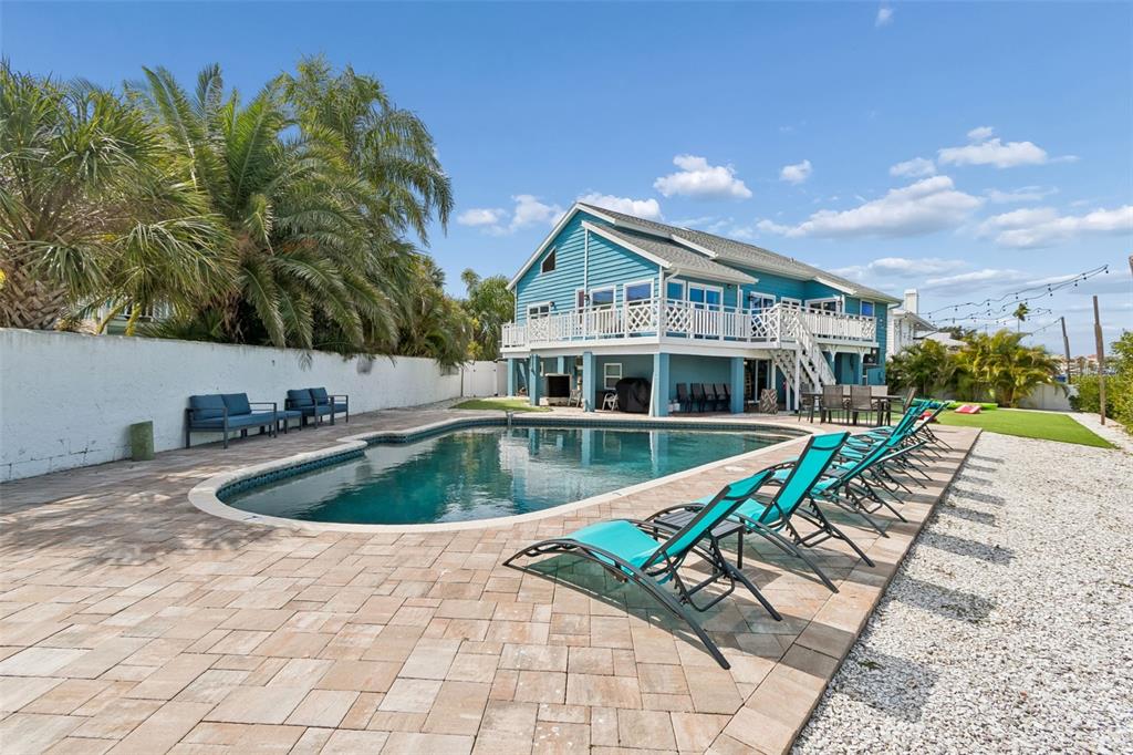 330 6th Avenue Indian Rocks Beach, FL 33785 - Photo 42 of 52 a view of a house with swimming pool and sitting area