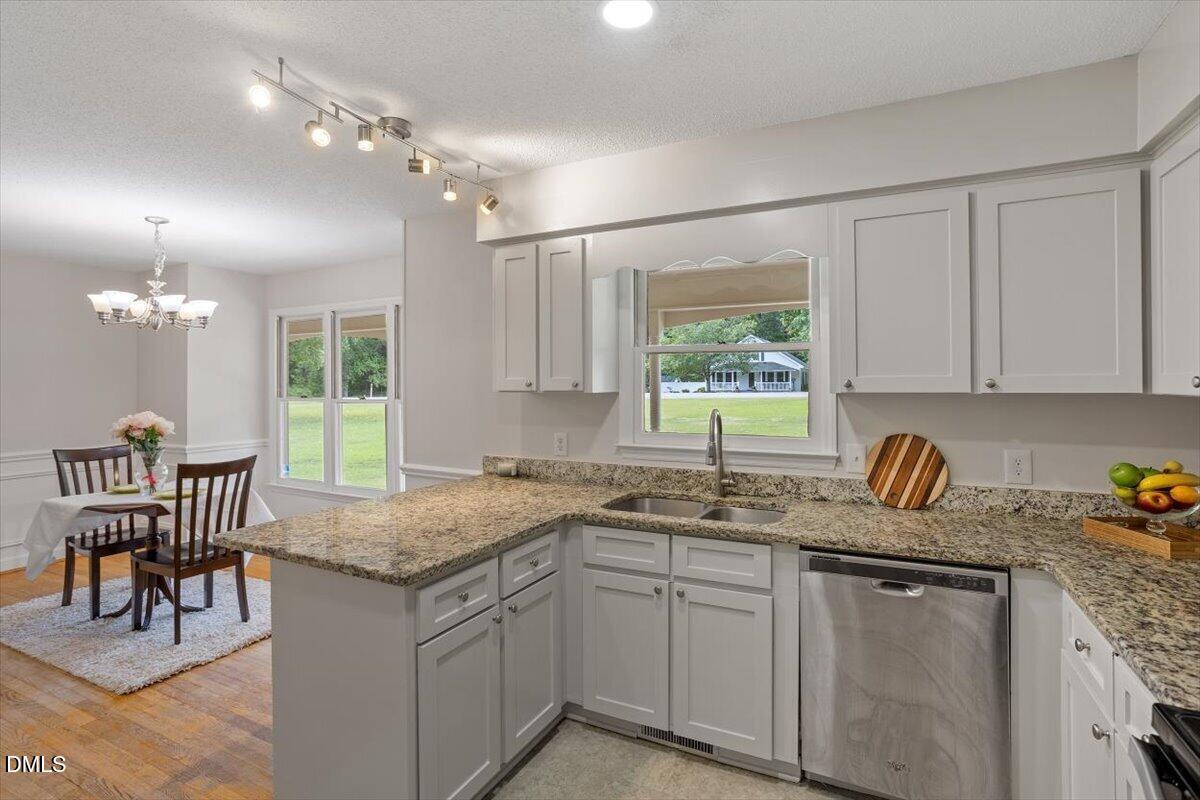 805 Rand Road Garner, NC 27529 - Photo 27 of 38 a kitchen with sink cabinets and window