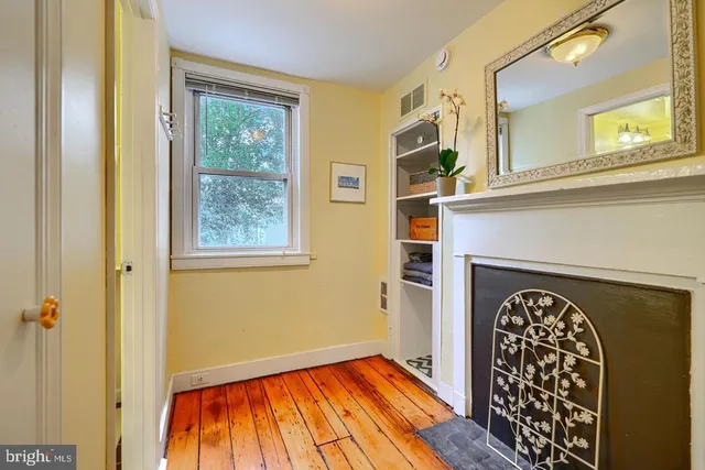 a view of an entryway with wooden floor