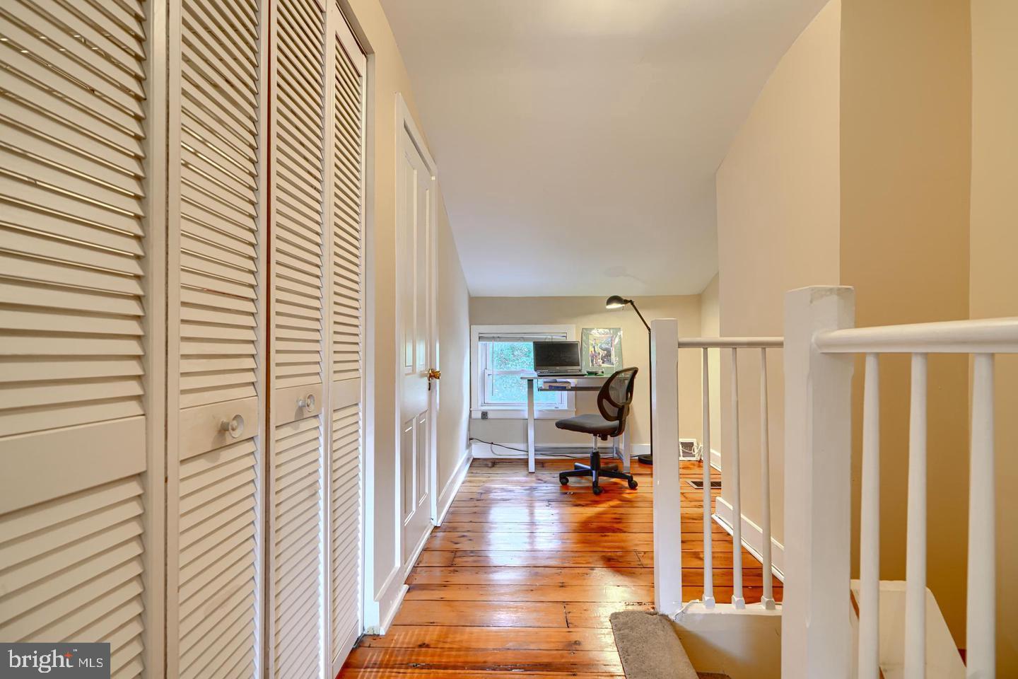 1806 Bank Street Baltimore, MD 21231 - Photo 15 of 21 a view of a hallway with a livingroom with furniture