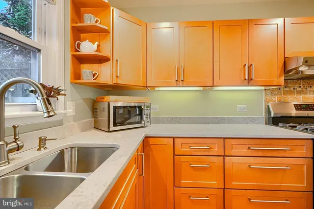 a kitchen with a sink and a window