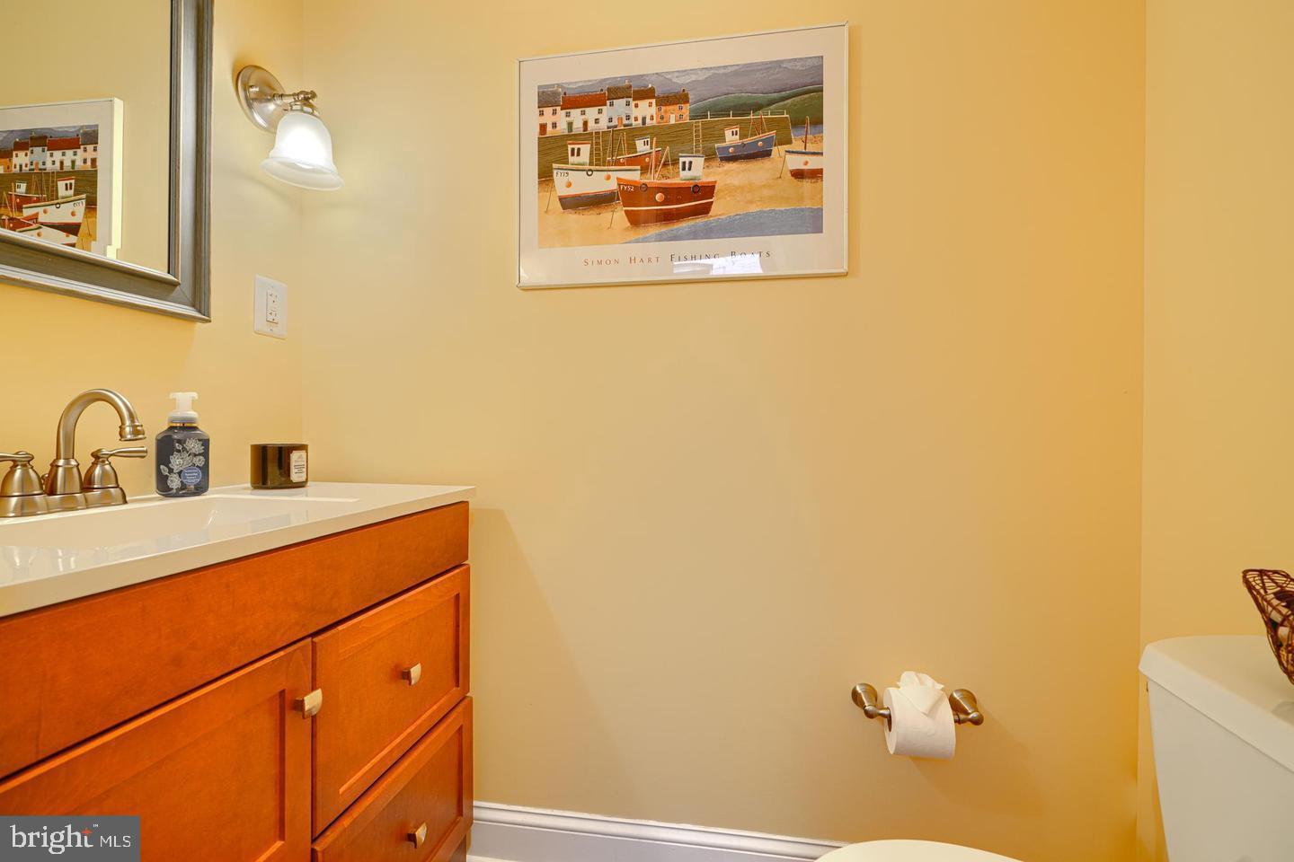 1806 Bank Street Baltimore, MD 21231 - Photo 9 of 21 a bathroom with a sink and a mirror