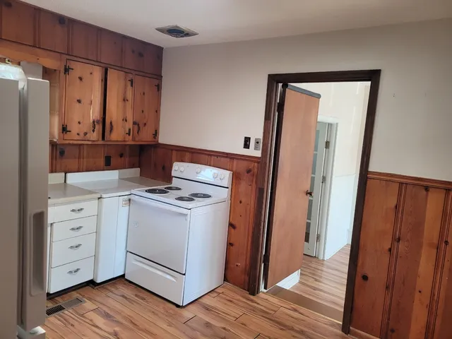 a view of cabinets with wooden floor