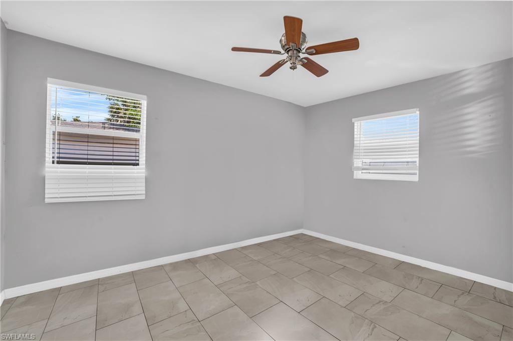 883 Coconut Circle East Naples, FL 34104 - Photo 23 of 32 a view of a big room with carpet