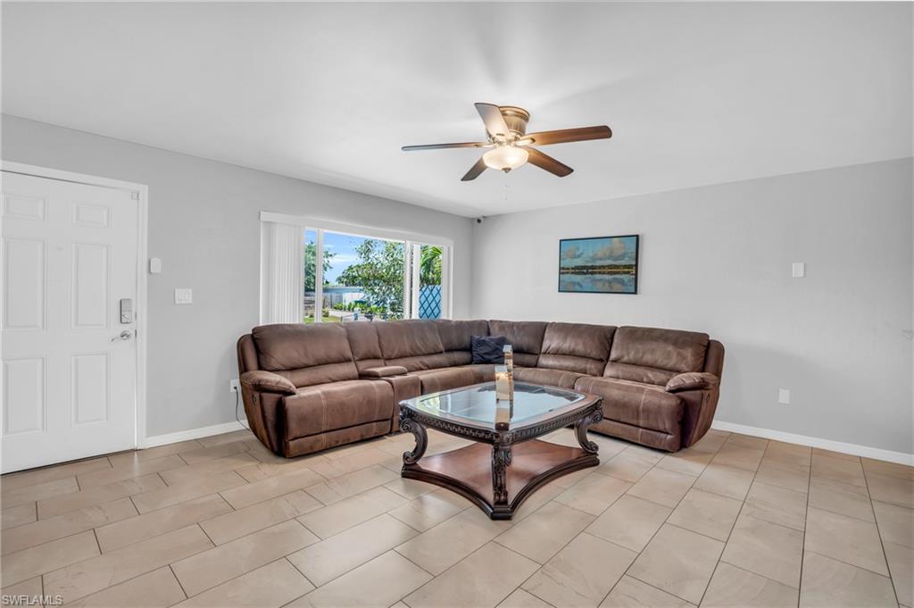 883 Coconut Circle East Naples, FL 34104 - Photo 4 of 32 a living room with furniture and a window