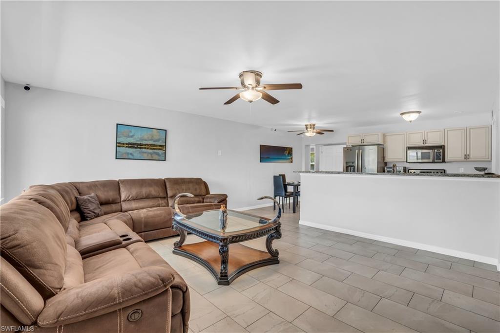 883 Coconut Circle East Naples, FL 34104 - Photo 5 of 32 a living room with furniture