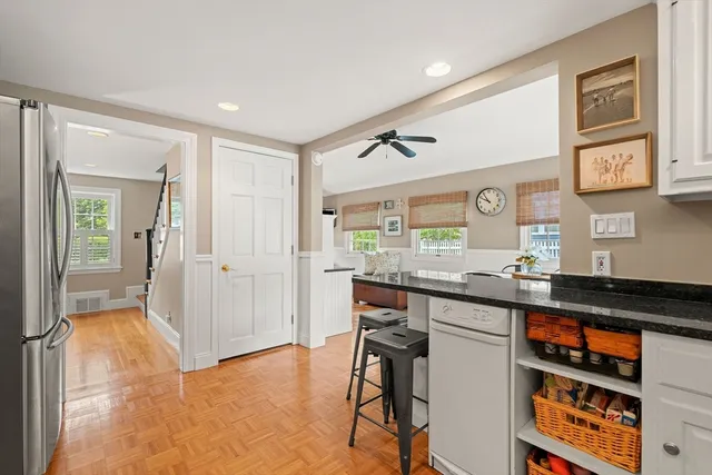 a kitchen with granite countertop a sink and cabinets