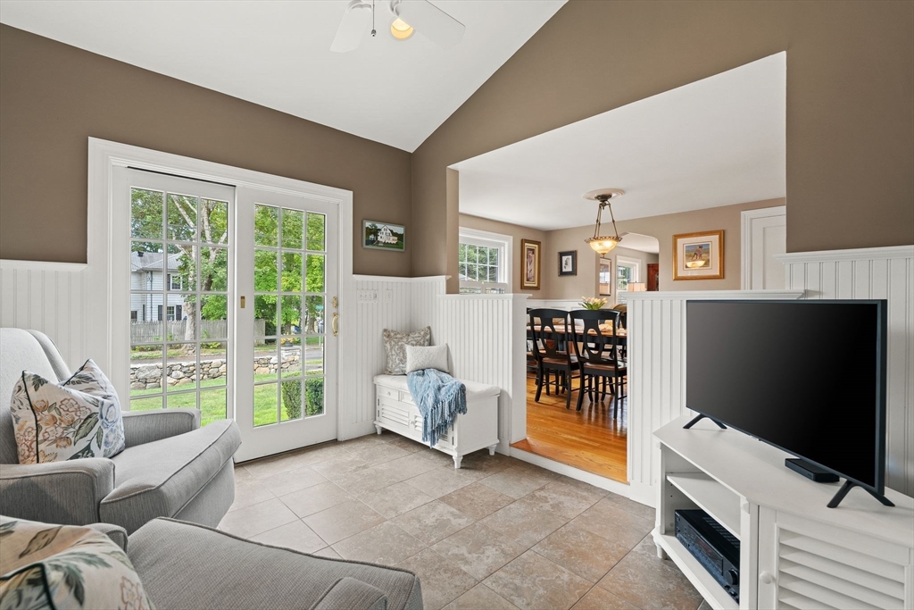 4 Joyce Road Arlington, MA 02474 - Photo 19 of 42 a living room with furniture and a flat screen tv