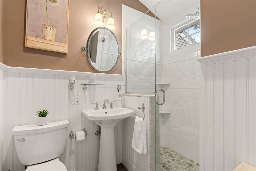 4 Joyce Road Arlington, MA 02474 - Photo 21 of 42 a bathroom with a sink toilet and a mirror