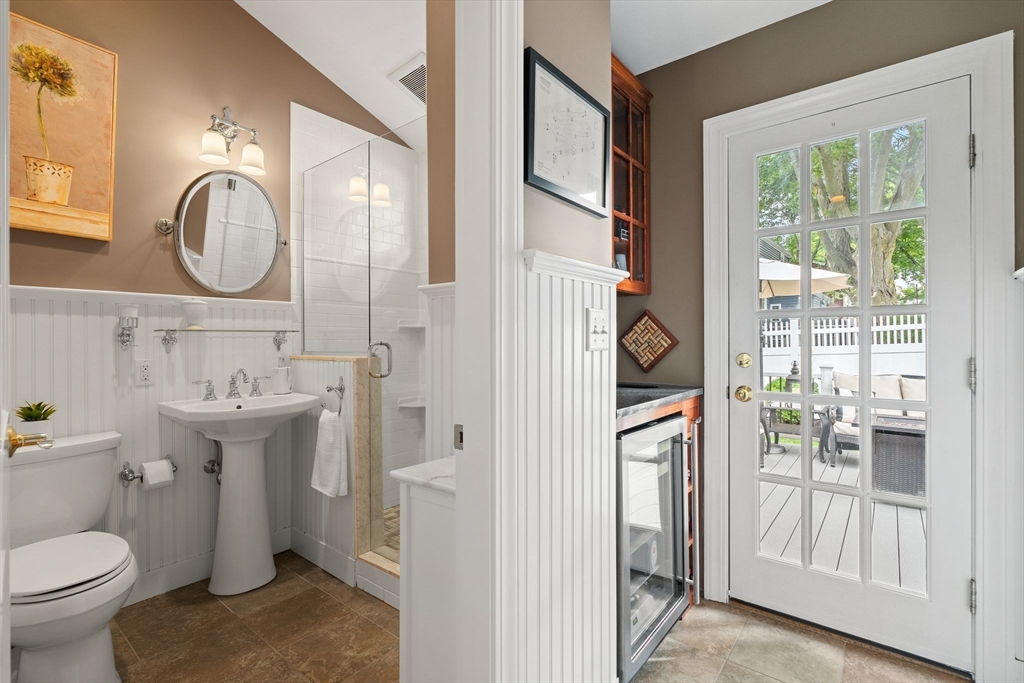 4 Joyce Road Arlington, MA 02474 - Photo 22 of 42 a bathroom with a sink a toilet and a mirror