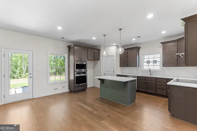 a view of kitchen with wooden floor