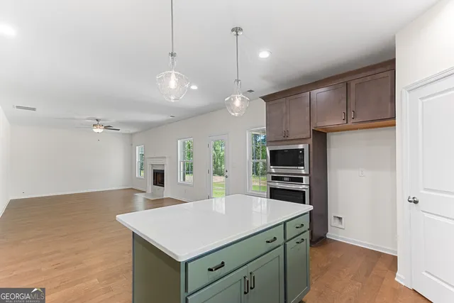 a bathroom with a sink a mirror and a vanity