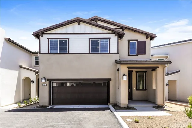a front view of a house with garage