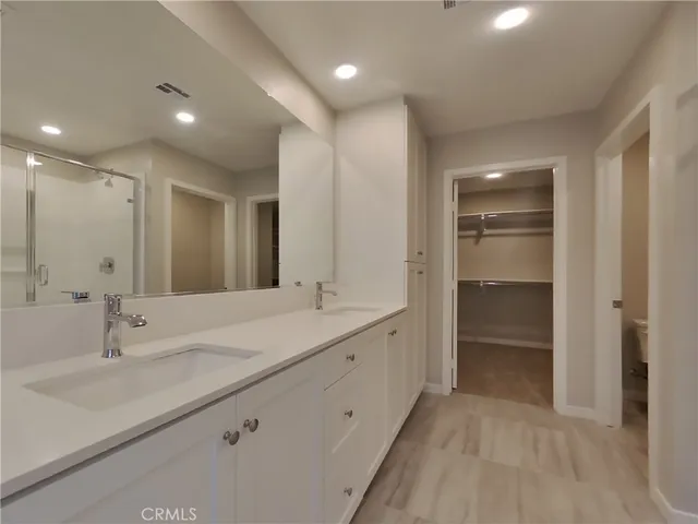 a bathroom with a double vanity sink mirror and double