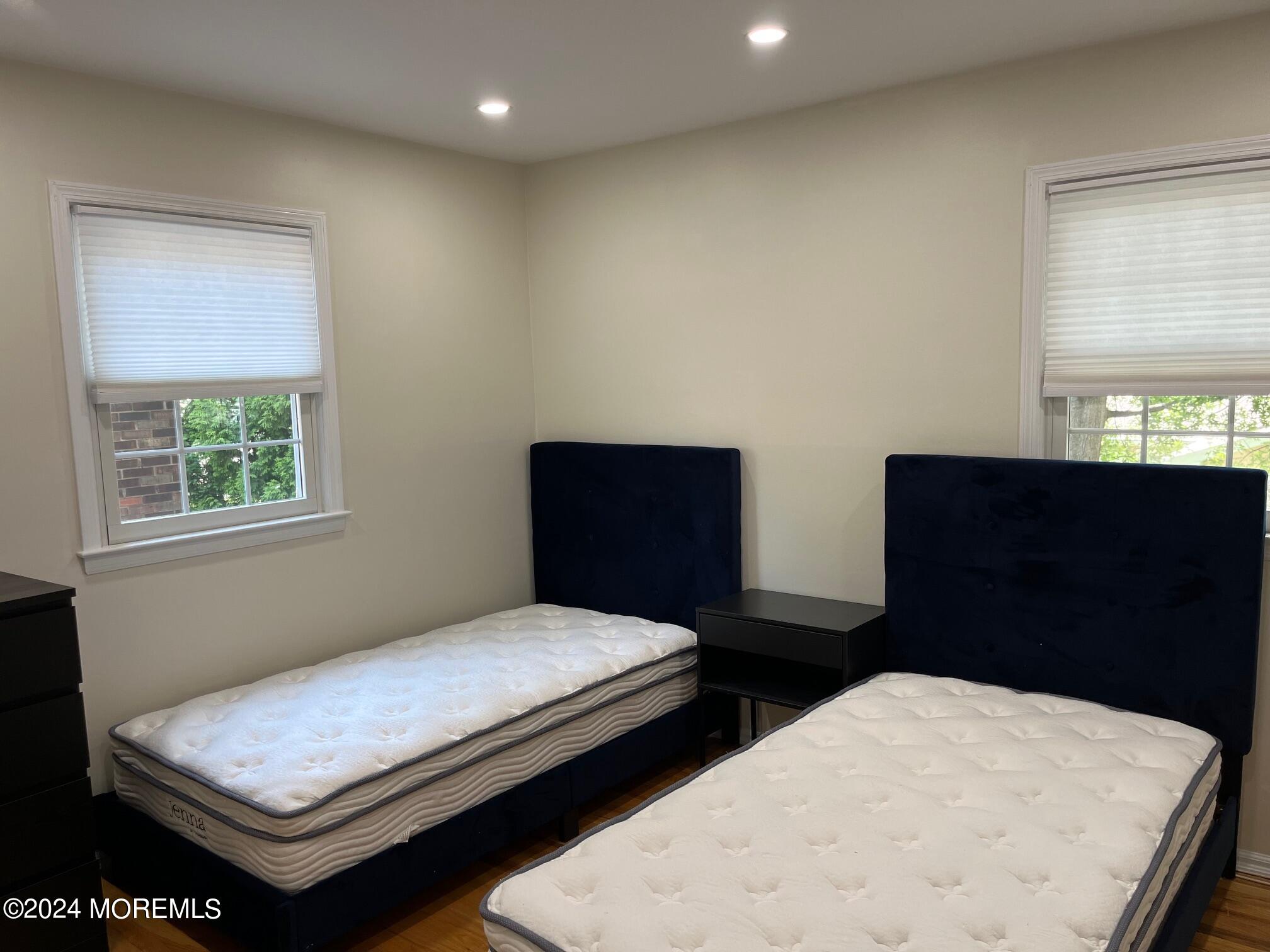 106 Pear Street Oakhurst, NJ 07755 - Photo 14 of 21 a bedroom with two beds and a window