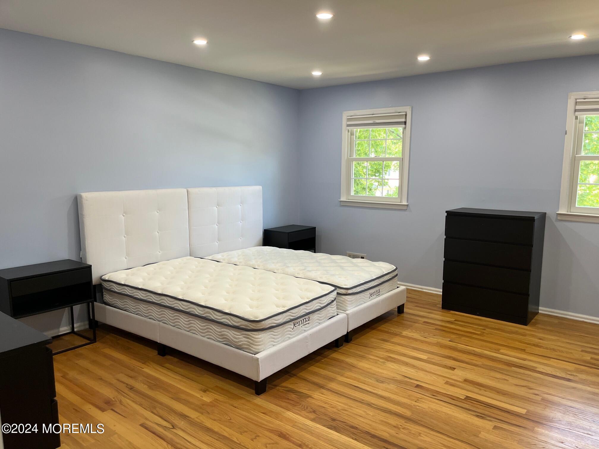 106 Pear Street Oakhurst, NJ 07755 - Photo 15 of 21 a bedroom with a bed and window