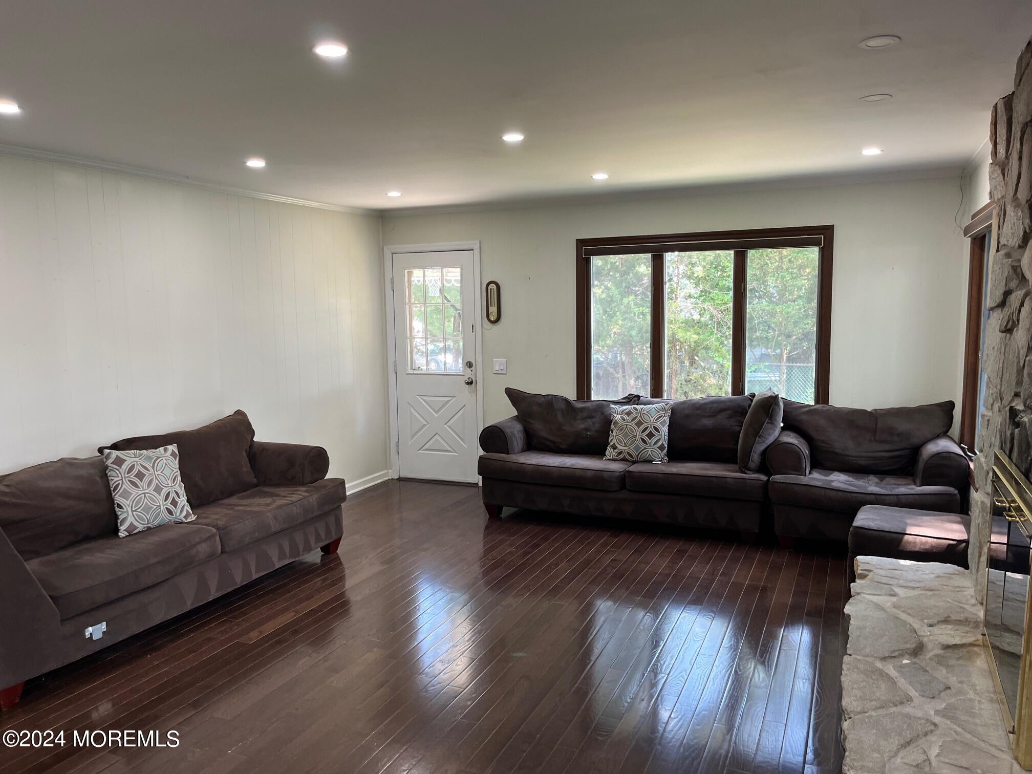 106 Pear Street Oakhurst, NJ 07755 - Photo 8 of 21 a living room with furniture and a large window