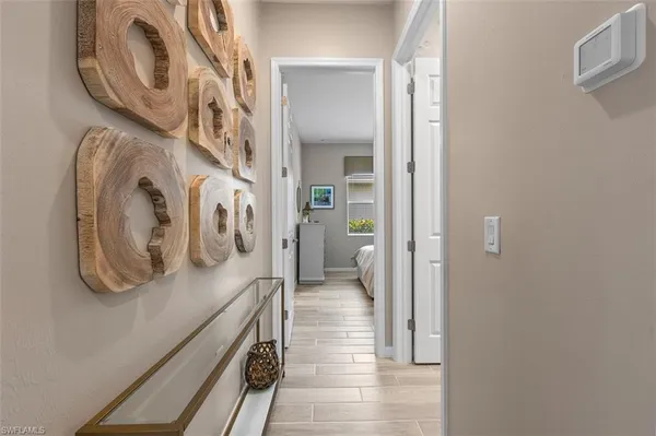 a view of a hallway with washer and dryer