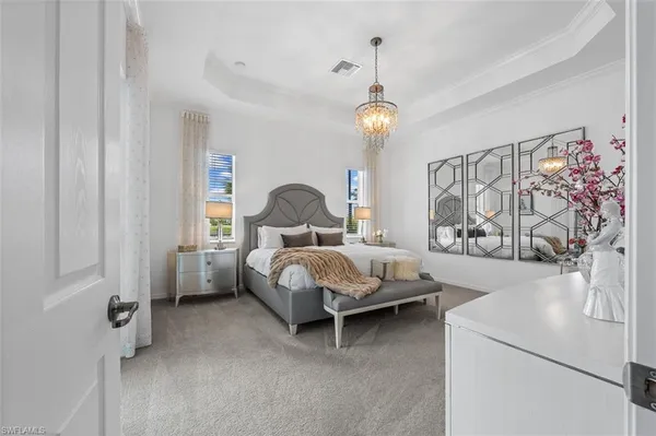 a bed room with a bed and a chair