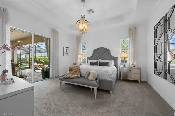 a bedroom with bed and windows