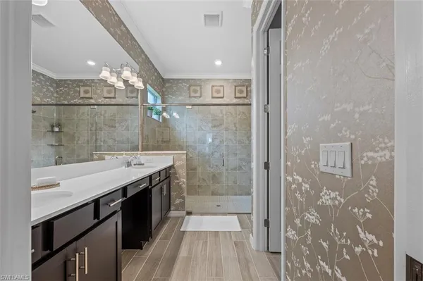 a bathroom with a shower and a sink