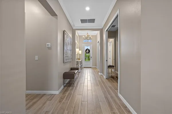 a view of gallery with wooden floor