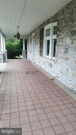 a view of a brick house with a yard