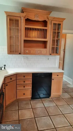 a kitchen with a stove and a cabinets