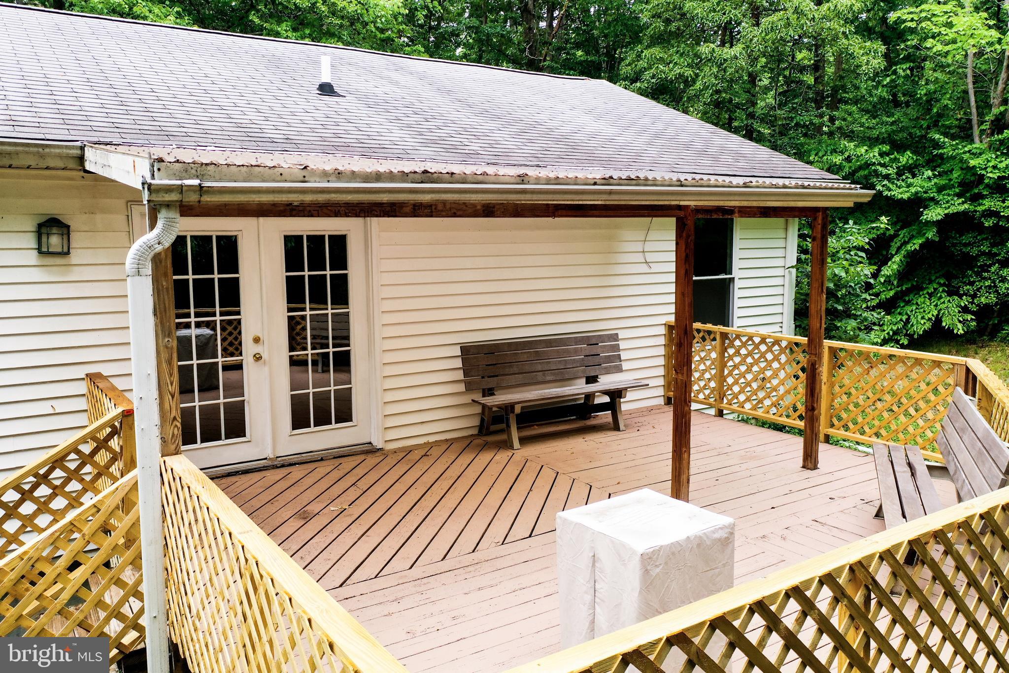 2460 Johnson Road Huntingtown, MD 20639 - Photo 14 of 69 a view of a patio with a table and chairs