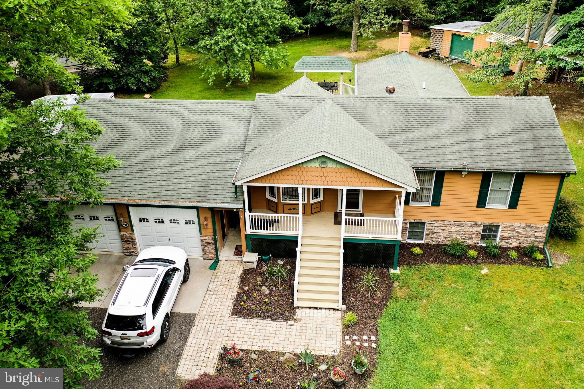 2460 Johnson Road Huntingtown, MD 20639 - Photo 3 of 69 an aerial view of a house with swimming pool