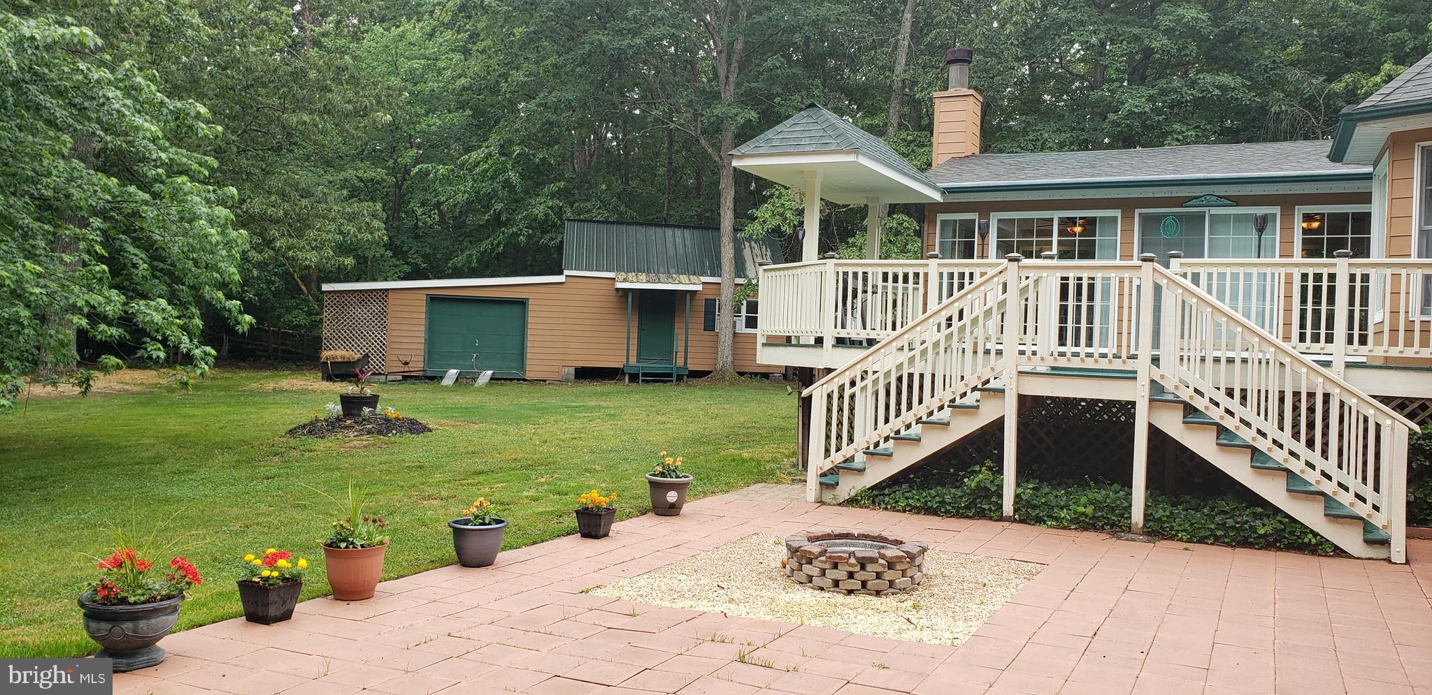 2460 Johnson Road Huntingtown, MD 20639 - Photo 49 of 69 a balcony with table and chairs