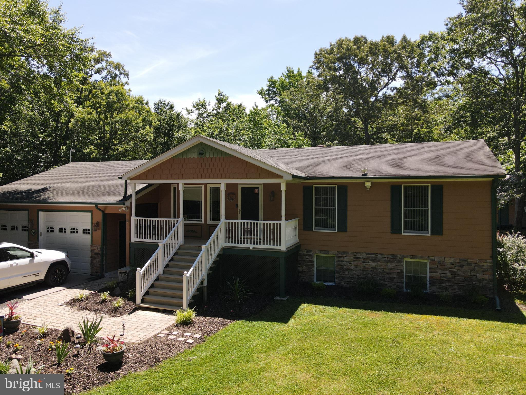 2460 Johnson Road Huntingtown, MD 20639 - Photo 8 of 69 a view of a house with a yard