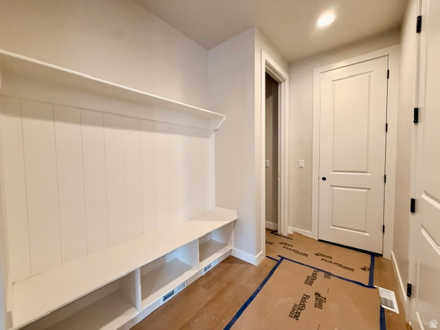 5885 Canyon Rim Road, Unit 624 Lehi, UT 84048 - Photo 9 of 10 Entryway mudroom featuring a built-in bench with storage cubbies and a top shelf