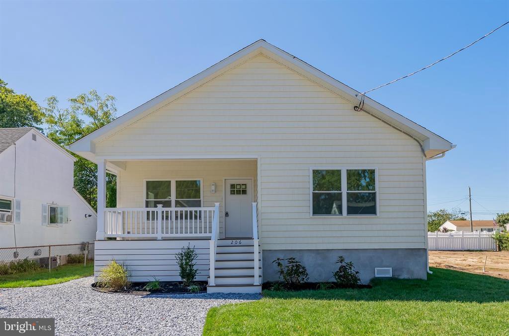 206 Frances Avenue, Unit A Villas, NJ 08251 - Photo 2 of 48 a front view of a house with garden