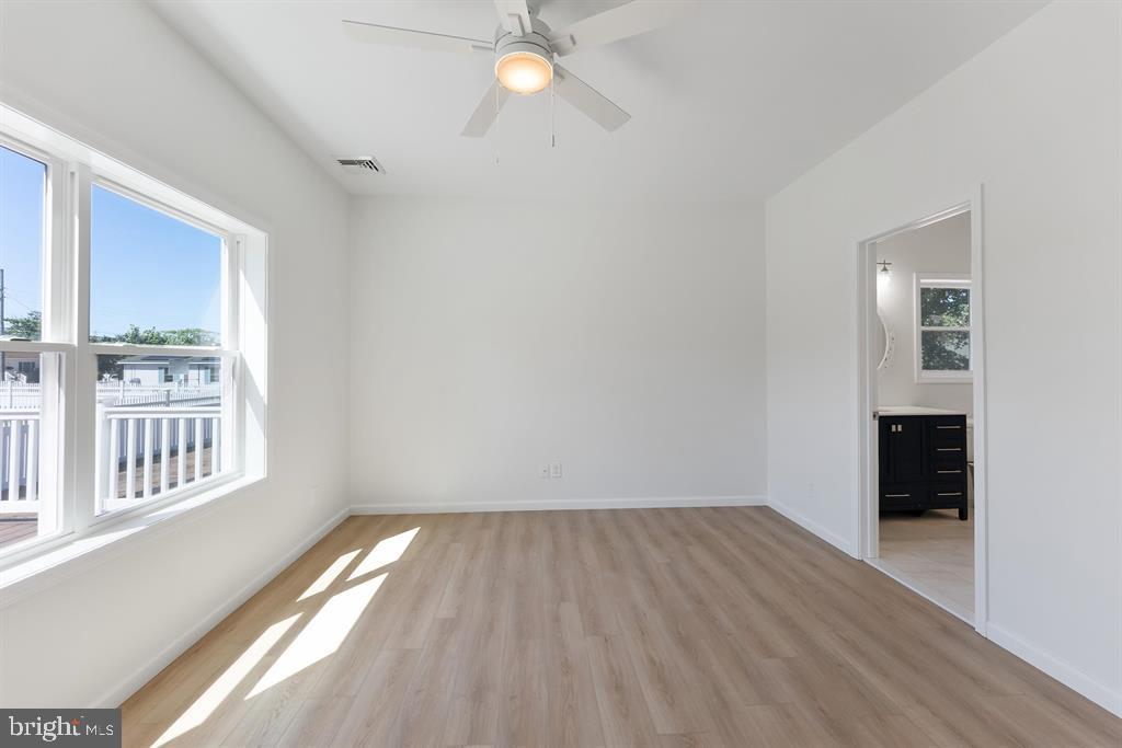 206 Frances Avenue, Unit A Villas, NJ 08251 - Photo 21 of 48 wooden floor in an empty room with a window