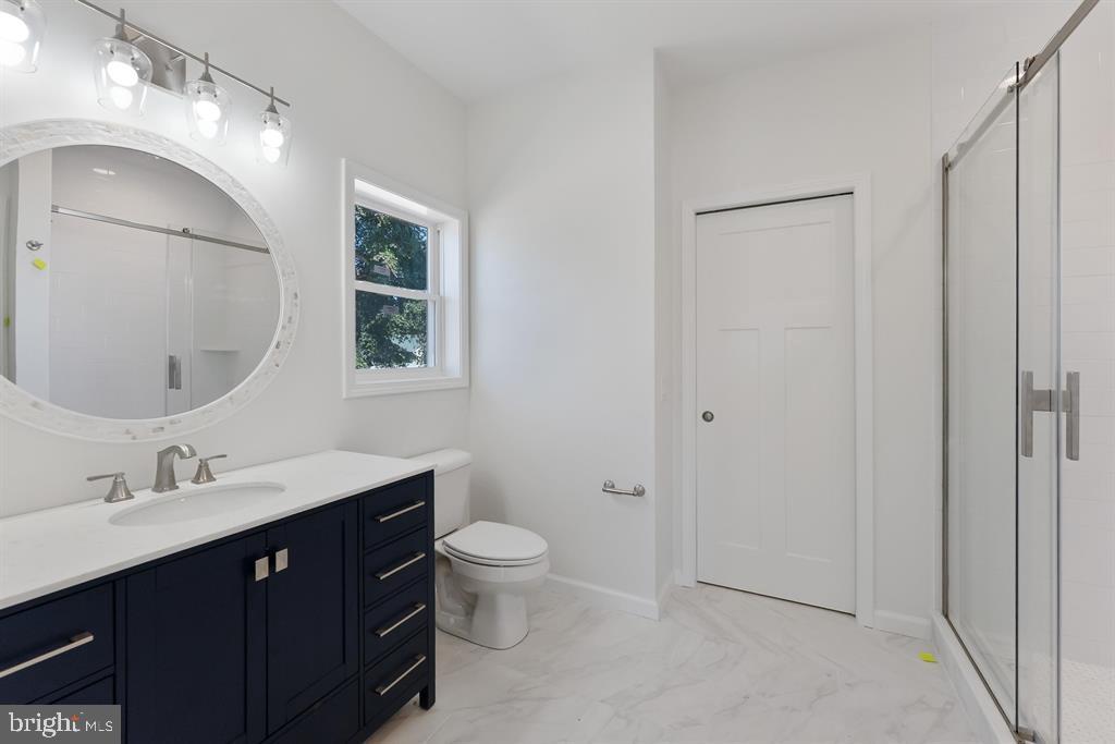 206 Frances Avenue, Unit A Villas, NJ 08251 - Photo 22 of 48 a bathroom with a toilet sink and mirror