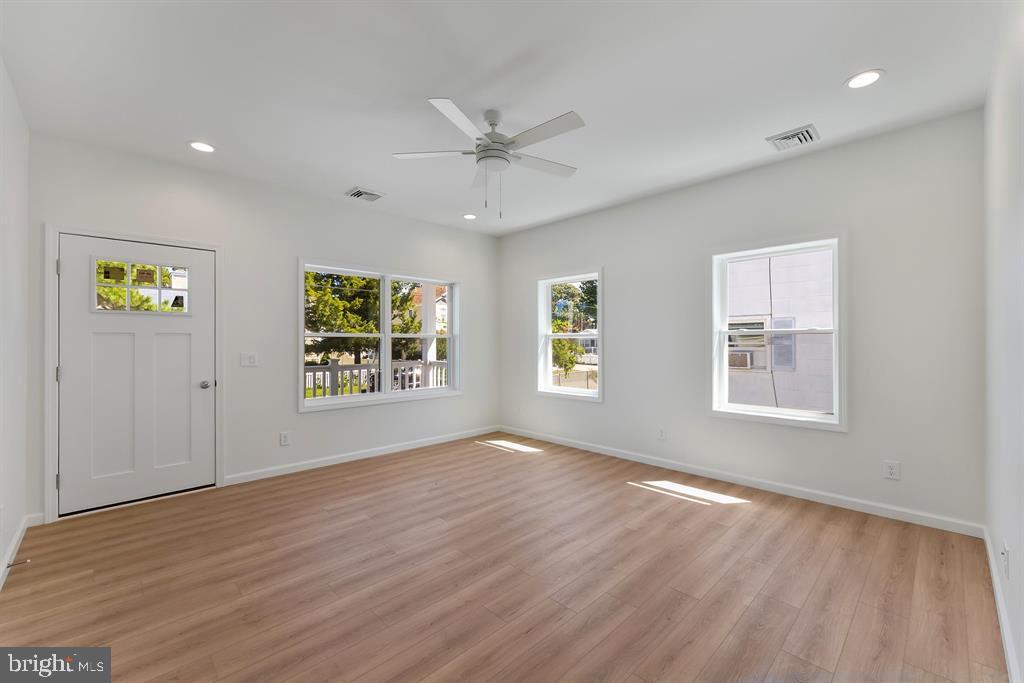 206 Frances Avenue, Unit A Villas, NJ 08251 - Photo 3 of 48 a view of an empty room with a window and wooden floor