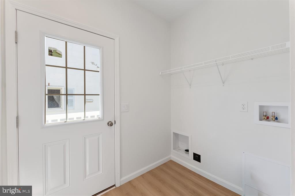 206 Frances Avenue, Unit A Villas, NJ 08251 - Photo 32 of 48 an empty room with a window and wooden floor