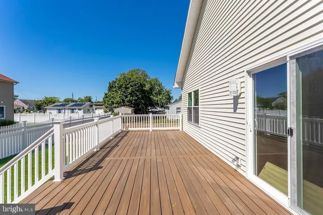 a view of a balcony with wooden floor