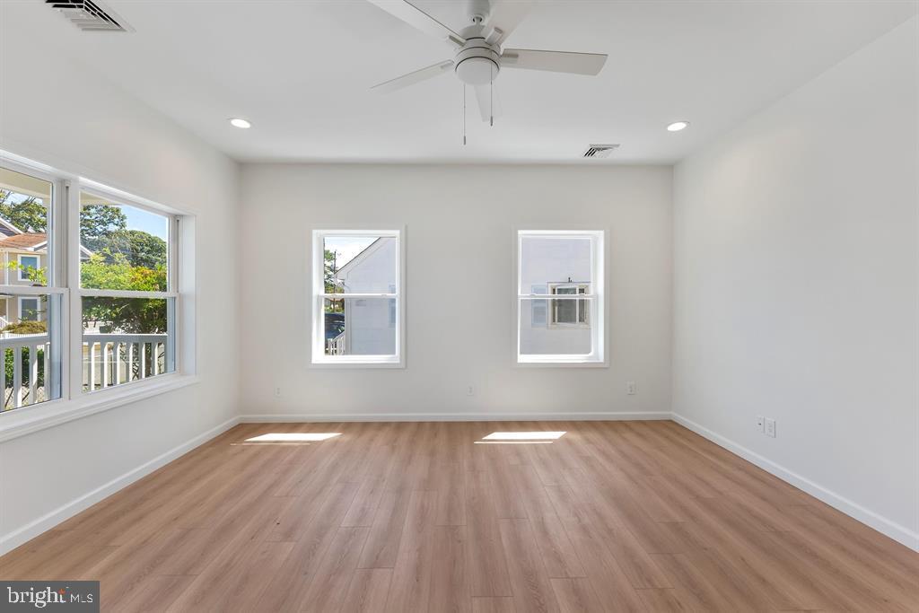 206 Frances Avenue, Unit A Villas, NJ 08251 - Photo 4 of 48 a view of an empty room with wooden floor and a window