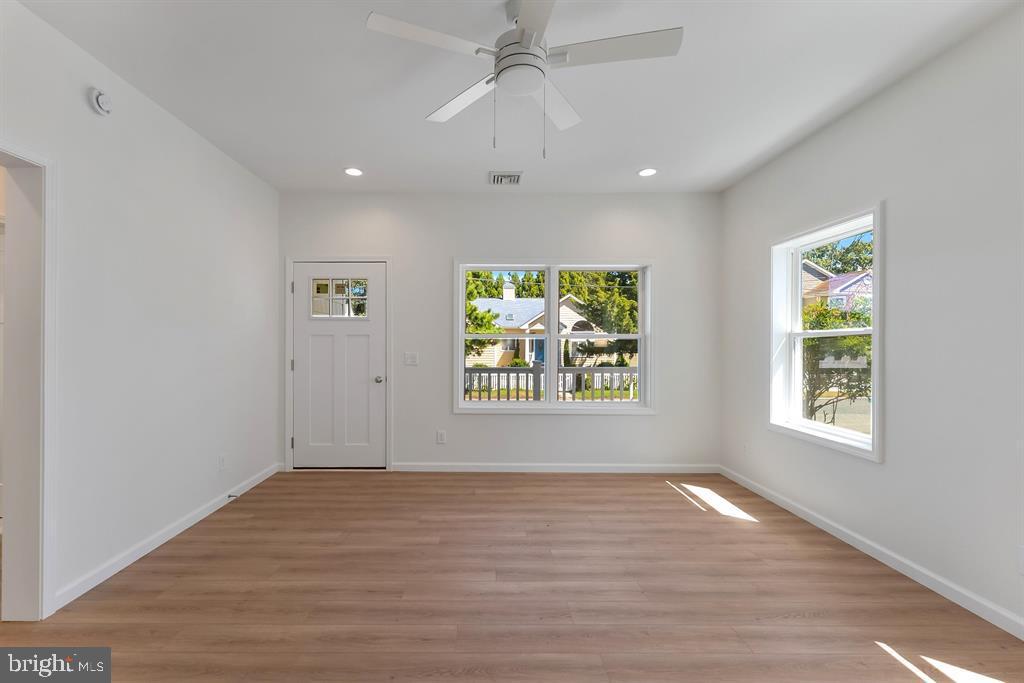 206 Frances Avenue, Unit A Villas, NJ 08251 - Photo 5 of 48 wooden floor in an empty room with a window