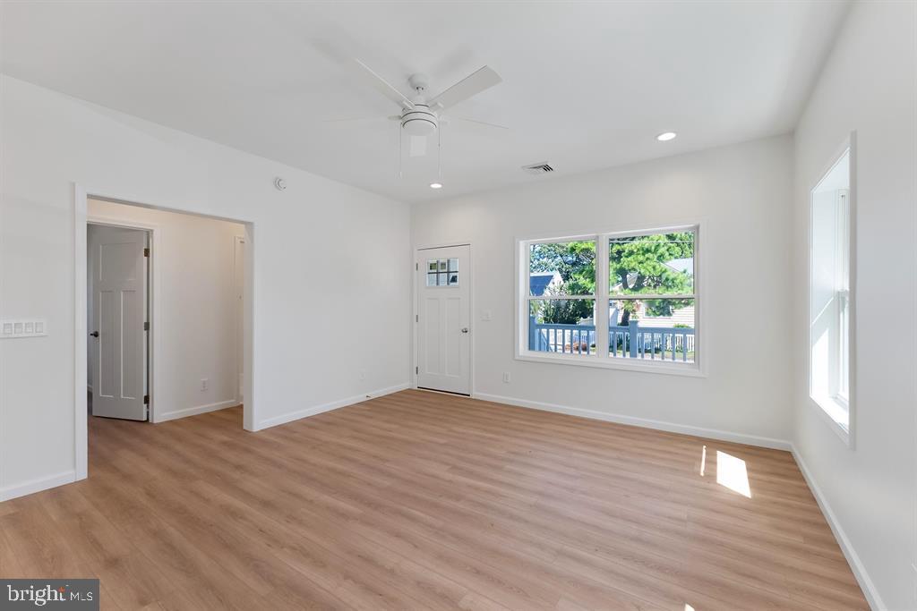 206 Frances Avenue, Unit A Villas, NJ 08251 - Photo 7 of 48 an empty room with wooden floor and windows