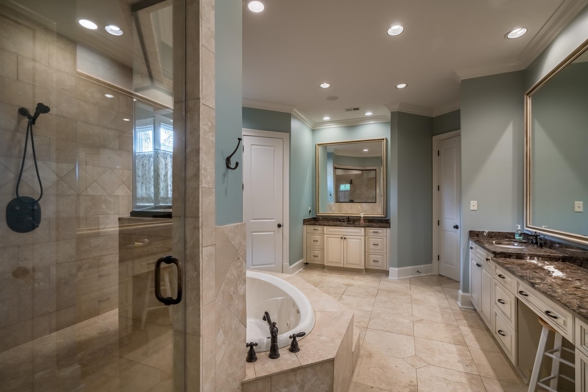 4410 Barfield Road Memphis, TN 38117 - Photo 14 of 25 a bathroom with a tub a sink a mirror and a shower