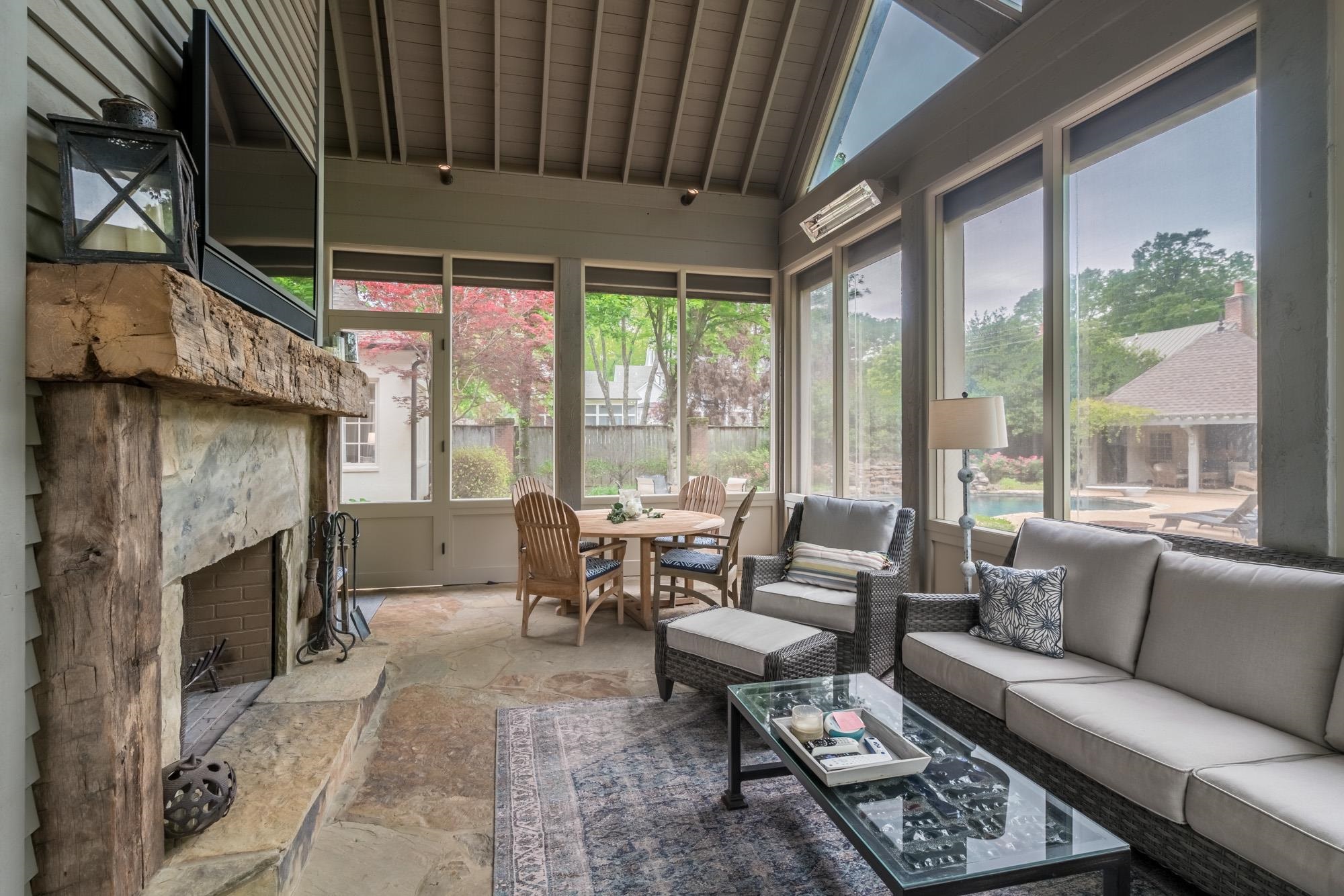 4410 Barfield Road Memphis, TN 38117 - Photo 23 of 25 a living room with furniture a fireplace and large windows